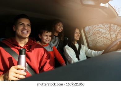 Happy Family With Little Children Inside Modern Car