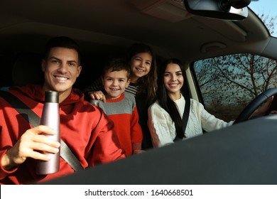 Happy Family With Little Children Inside Modern Car