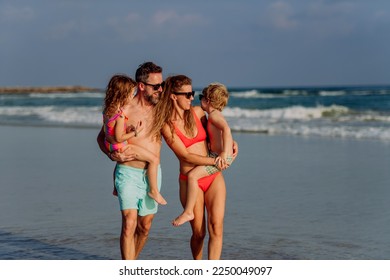 Happy family with little kids enjoying time at sea in exotic country. - Powered by Shutterstock