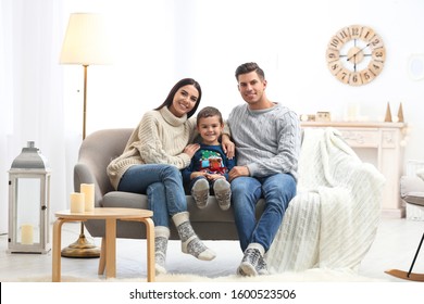 Happy Family With Little Son Spending Time Together At Home. Winter Vacation