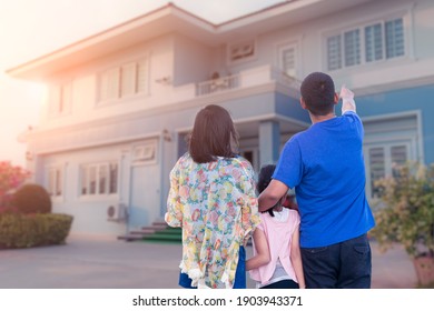 Happy Family Looking At  Dream House