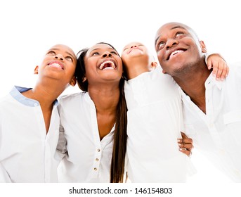 Happy family looking up and smiling - isolated over white background 