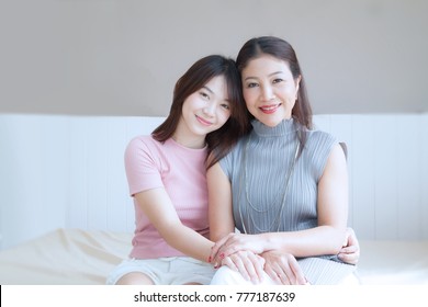 Happy family and Lovely Beautiful Mom And teenage daughter spend time together at home , mother's day - Shutterstock ID 777187639