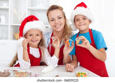 Happy Family Making And Decorating Christmas Cookies