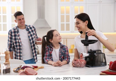 Happy Family Making Dinner Together In Kitchen, Woman Using Modern Meat Grinder