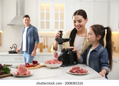 Happy Family Making Dinner Together In Kitchen, Mother And Daughter Using Modern Meat Grinder