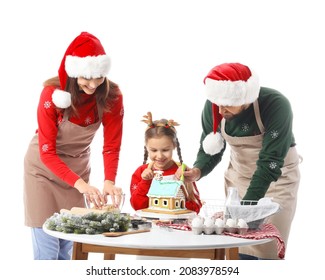 Happy Family Making Gingerbread House On White Background. Christmas Celebration