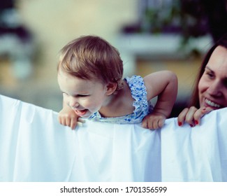 Happy Family Making Laundry Outside, Children Helping