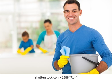 Happy Family Man Cleaning Home With His Family