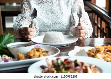 Happy Family Meal With Full Food On Table Asian Elder Mother Hand Holding Fork, Knife, Rice On Plate & Table. Enjoy True Authentic Exotic Homemade Healthy Thai Meal With Child On Holidays Thanksgiving