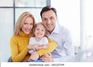 Happy Family In A Medical Clinic
