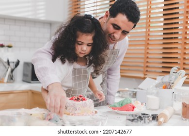 Happy Family Middle Eastern Preschool African Arab Kid Person Make Cake Cooking In Kitchen, Father And Daughter Prepare Decoration Cake With Fun Educate. Single Dad Spend Quality Time With His Kid.