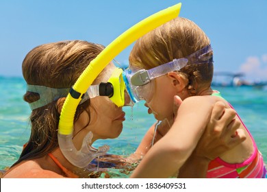 Happy Family - Mother, Baby Girl In Snorkeling Masks On Sea Beach Of Tropical Island. Funny Underwater Swimming Lesson. Travel Adventure, Swimming Activity On Summer Holiday Cruise With Kids.