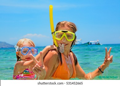 Happy Family - Mother With Baby Girl Dive Underwater With Fun In Sea Pool. Healthy Lifestyle, Active Parent, People Water Sport Outdoor Adventure, Swimming Lessons On Beach Summer Holidays With Child