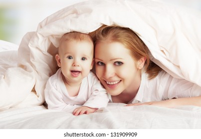 Happy Family. Mother And Baby Playing And Smiling Under A Blanket