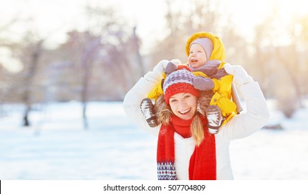 Happy Family Mother And Baby Is Happy The Snow On A Winter Nature Walk