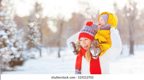 Happy Family Mother And Baby Is Happy The Snow On A Winter Nature Walk