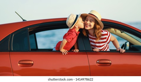 happy  family mother and child boy goes to summer travel trip in the car