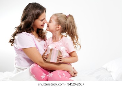 Happy Family. Mother And Daughter With Pink Gift Box