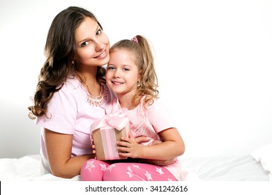 Happy Family. Mother And Daughter With Pink Gift Box