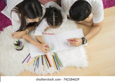 Happy Family. Mother And Daughter Together Paint. Adult Woman Helps The Child Girl. Family Drawing Together