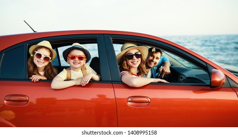 Happy Family Mother Father And Children In Summer Auto Journey Travel By Car On Beach
