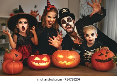 happy family mother father and children in costumes and makeup on a celebration of Halloween - Shutterstock ID 714728209