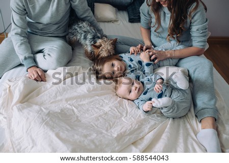 Similar – Top view of happy children having breakfast in the bed with their mother in a relaxed morning