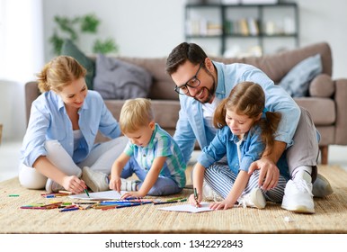 happy family mother father and kids draw together at a home  
 - Powered by Shutterstock