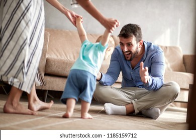 happy family mother and father playing with a baby boy at home
 - Powered by Shutterstock