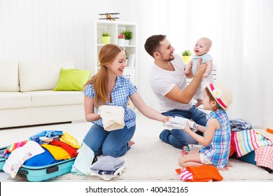 happy family mother, father and two children packed suitcases for the trip holiday travel vacation - Shutterstock ID 400432165