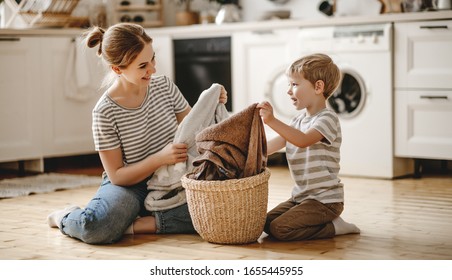 Happy family mother housewife and child son in laundry with washing machine 
 - Powered by Shutterstock