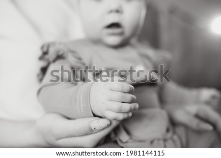 Similar – Kind hält die Hand eines neugeborenen Babys