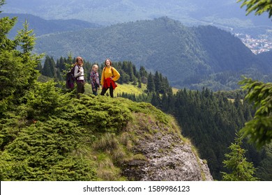 happy family in the mountains. mother with daughters are walking in the mountains