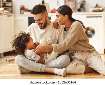 Happy Family Multi Ethnic Mother, Father And Son  Laughing, Playing,and Tickles In Bed In Bedroom At Home
