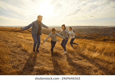 Happy family nature outdoor vacation, playing, spending weekend holiday together, parents, children enjoy time. Friendly open air fun, resting recreation activity, country pleasure or rural life walk - Powered by Shutterstock