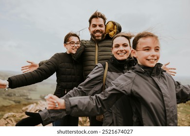 Happy family in nature outdoors. Smiling family with two kids, enjoying nature. Family bonding in nature outdoor fun. Happy family, outdoor adventure - Powered by Shutterstock