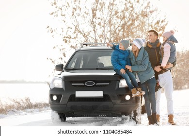 Happy Family Near Car On Winter Day