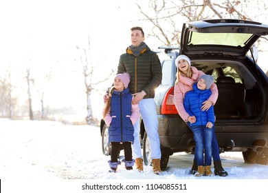 Happy Family Near Car On Winter Day