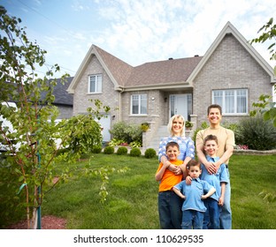 Happy Family Near New House. Real Estate Concept.