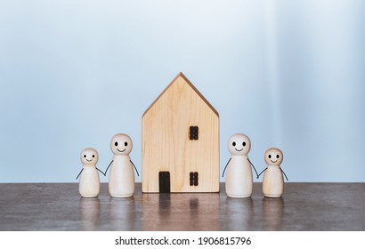 Happy Family And New Home Concept.House Wood With Wooden Doll,family Day Care,Home Sweet Home,stay At Home.