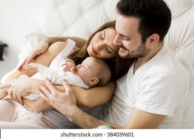 Happy Family With Newborn Baby