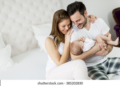 Happy Family With Newborn Baby