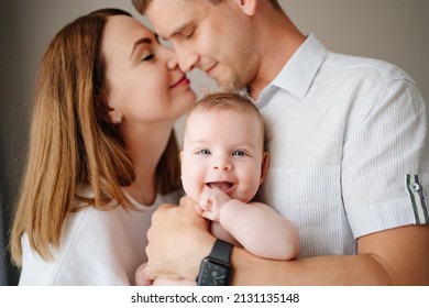 a happy family with a newborn baby. mom, dad and baby. psychological assistance to young parents. products and cosmetics for the whole family. foster family and adoption of children.