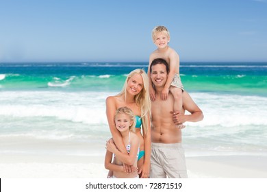 Happy Family On The Beach