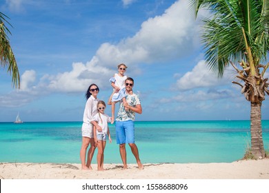 Happy family on a beach during summer vacation