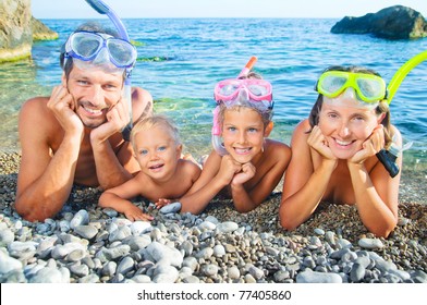 Happy Family On Beach With Snorkles Ready To Have A Good Time Swimming