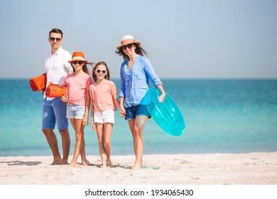 Happy family on the beach at summer vacation