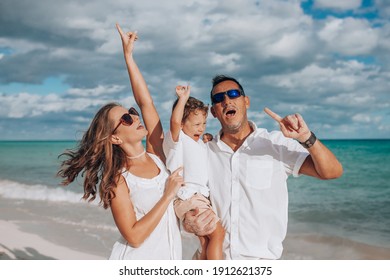 Happy Family On The Beach. Family Vacation