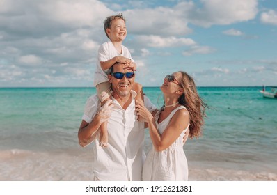 Happy Family On The Beach. Family Vacation